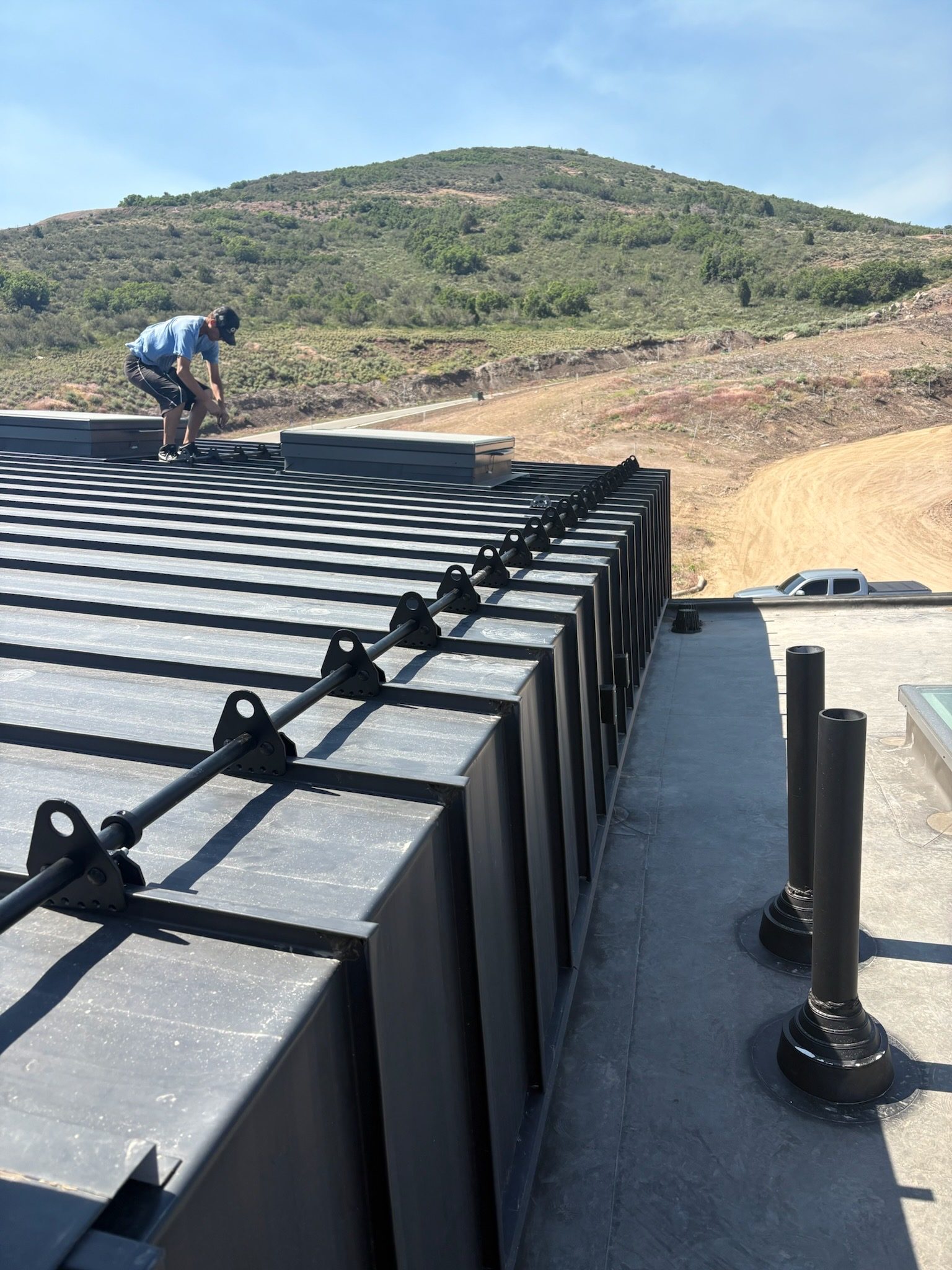 Setting standing seam panels